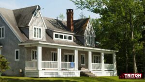a two story home with a white porch