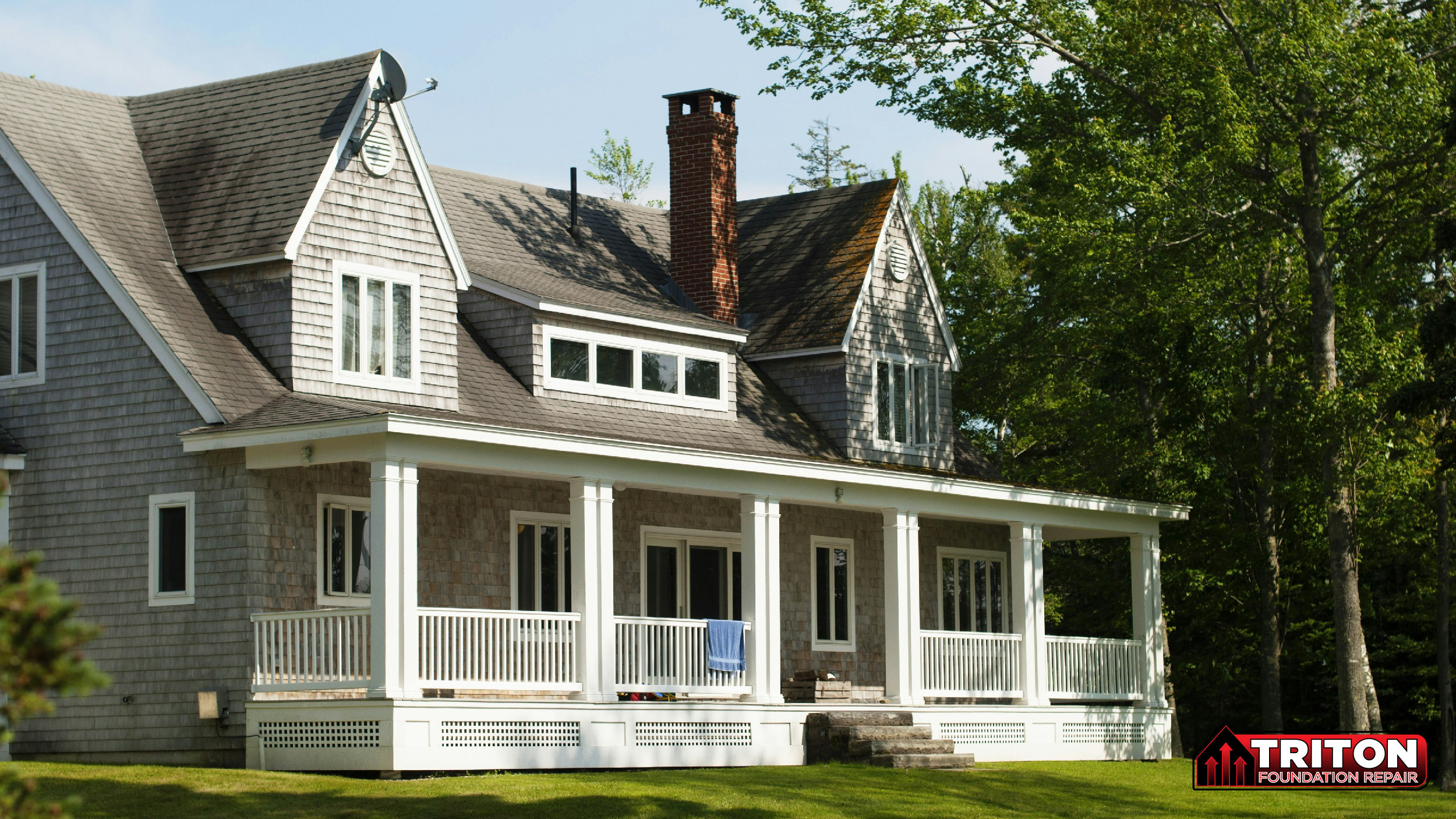 a two story home with a white porch